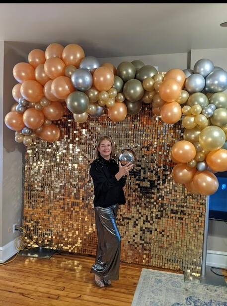 Gold and peach garland and shimmery wall